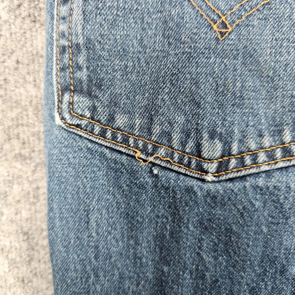 Vintage 1999 Levis 550 Relaxed Fit Jeans Mens 42x32 Medium Wash Distressed Denim
